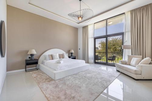 a white living room with a bed and a couch at Luxury 5-BR Villa Private Pool Golf Views in Dubai