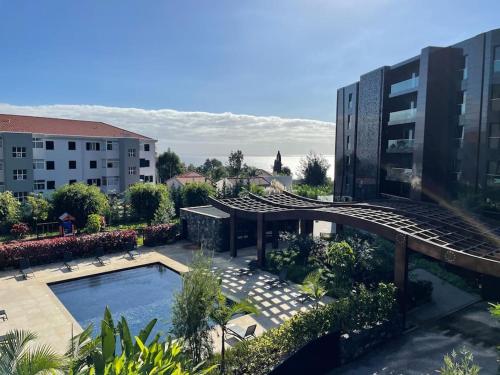 a view of a building with a swimming pool at Magic Home, everything you need. in Funchal