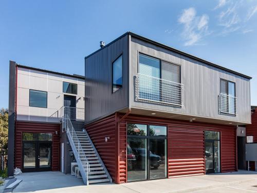 a house with a staircase on the side of it at The Web Suites in Friday Harbor