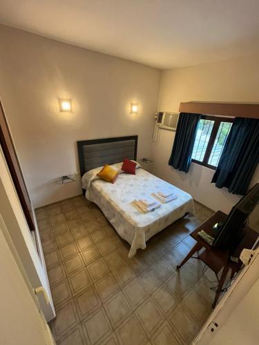 a bedroom with a bed and a chair in it at Apartamento Nuevo Centro in Córdoba
