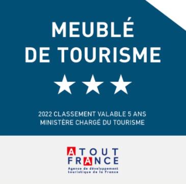 a blue sign with white stars on it at Ti karet - Charmant logement avec Jacuzzi et vue mer in Terre-de-Haut