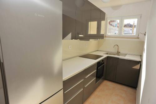 Kuchyň nebo kuchyňský kout v ubytování Apartments Barbara Sutivan