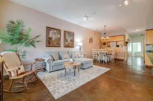 a living room with a couch and a table at Southern Charmer-Historic District Downtown-Front Porch-Walk Score 90!!- FREE Private Parking-1 Min Walk to Forsyth Park in Savannah