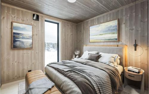 A bed or beds in a room at Cozy Home In B I Telemark With Sauna