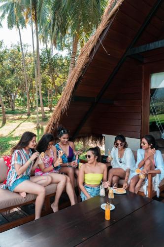 a group of women sitting around a table at Coconut Escapes in Kurunegala