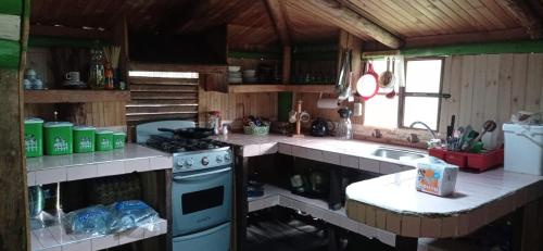 Η κουζίνα ή μικρή κουζίνα στο CABAÑA ENCANTO