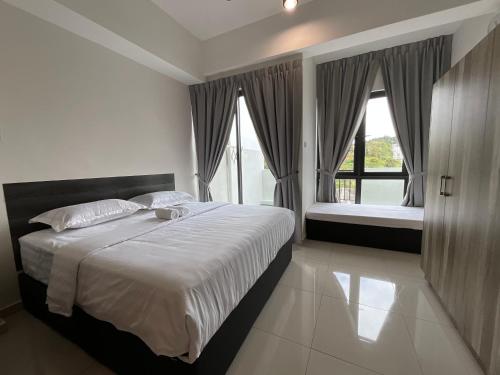 a bedroom with a large bed and a window at Themework Homestay@Cameron Highlands in Cameron Highlands
