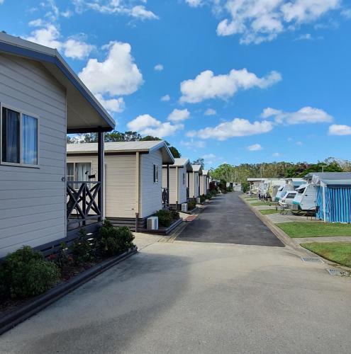 a row of houses parked next to each other at Sunset Caravan Park Woolgoolga in Woolgoolga