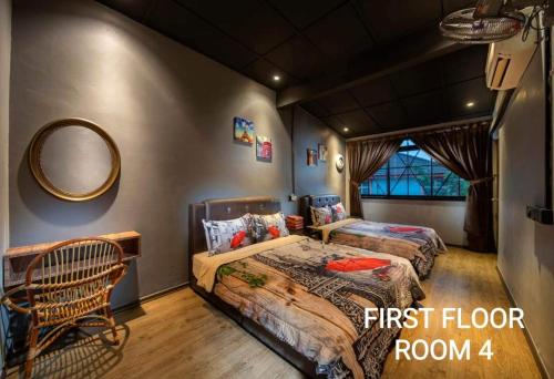 a bedroom with two beds and a mirror at ECO Haus Garden Residential in Johor Bahru