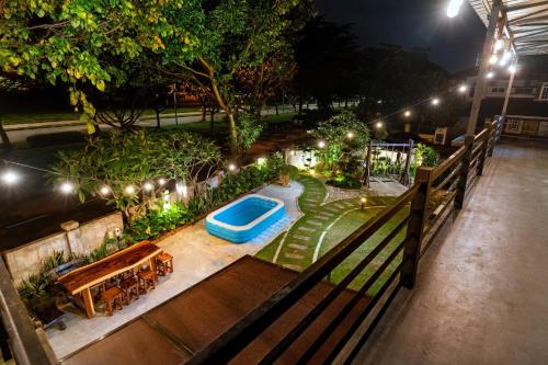 an overhead view of a pool in a garden at night at ECO Haus Garden Residential in Johor Bahru