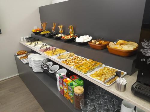 a buffet line with many different types of food at Comfort Center Suit Hotel in Edirne