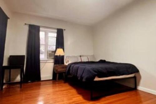 a bedroom with a bed and a window at 2 BR Private Suite Near Major Hospitals, Yale & DT in Woodbridge