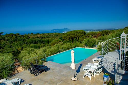 a villa with a swimming pool and a view of the ocean at Villa Letizia in Terracina