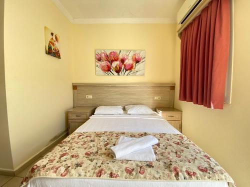 Кровать или кровати в номере Sevin Hotel Pension