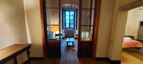 a room with a door leading to a bedroom at Castello di Mugnana in Mugnana