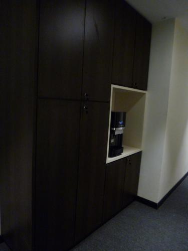 a black cabinet with a microwave in a room at 9 Square Hotel - Bandar Baru Bangi in Bangi