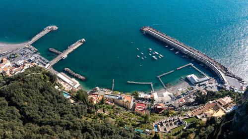 an aerial view of a harbor with boats in the water at Torre di Amalfi - holiday house in Amalfi