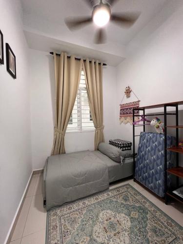 a bedroom with a bed and a window at Urban Gateway Homestay# Bangi#Wifi 300Mbps#Netflix in Kampong Tangkas