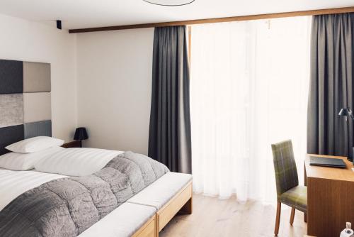 Postel nebo postele na pokoji v ubytování Hotel Schöne Aussicht