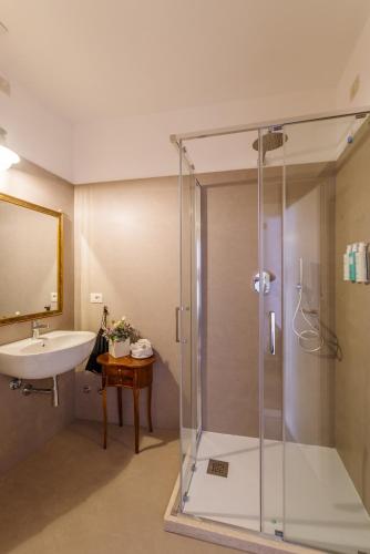 a bathroom with a shower and a sink at Aurora Boutique Hotel & Private SPA in Spoleto