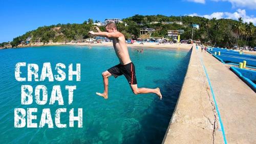 a man jumping into the water at a beach at HNG APARTMENT, LINDO LUGAR, VENGA Y LO PASARÁ BIEN in Victoria