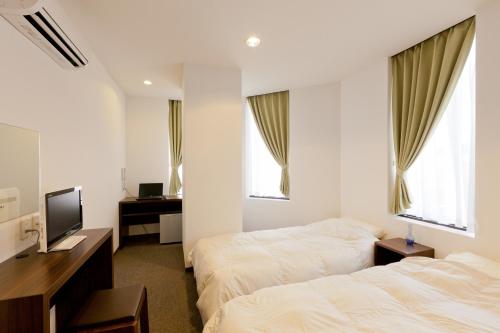 Cama o camas de una habitación en Suminoyu Hotel