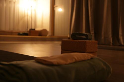 a pile of boxes sitting on top of a bed at Hemavans Wärdshus in Hemavan