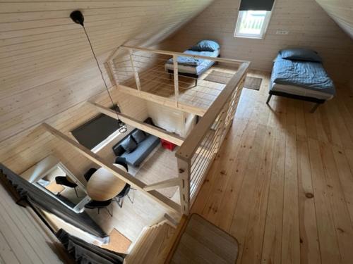 an overhead view of a room with a bunk bed at FirLake domki nad jeziorem Firlej in Firlej