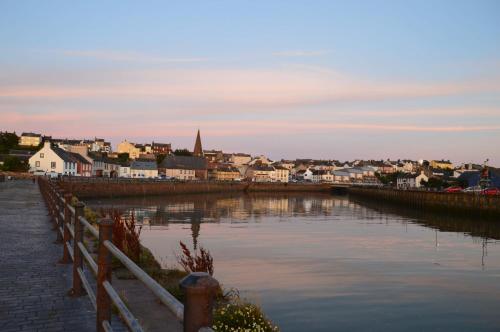 a view of a town with a river and a city at Blue Anchor House in Maryport