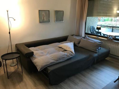 Säng eller sängar i ett rum på Apartment am Klinikviertel
