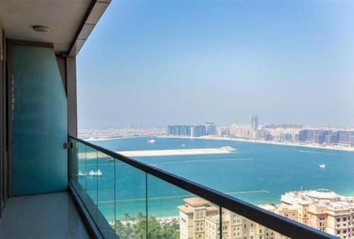 a view of the ocean from a balcony of a building at Ocean Heights - Spacious 1 Bedroom Apartment with Sea View, Gym & Free Parking in Dubai