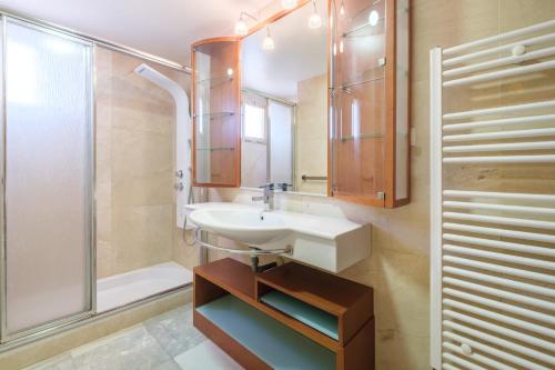 a bathroom with a sink and a shower at Principado Arena 18-A Levante Beach in Benidorm