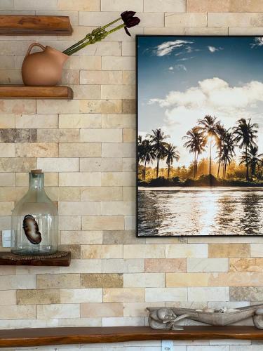 a picture of palm trees on a wall at Pousada Minha Praia in João Pessoa