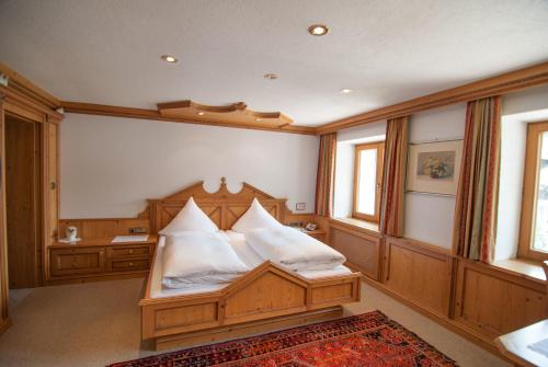Ein Bett oder Betten in einem Zimmer der Unterkunft Pension Strolz
