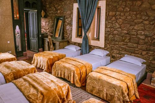 Postel nebo postele na pokoji v ubytování Riad Kasbah Omar