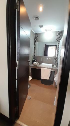 a bathroom with a sink and a mirror at Quinta Manuela in Mendoza