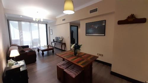 a living room with a couch and a table at Quinta Manuela in Mendoza