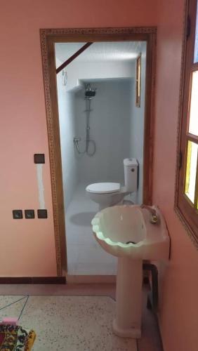 a bathroom with a sink and a toilet at Chez L'habitant Brahim kanih in Anzel
