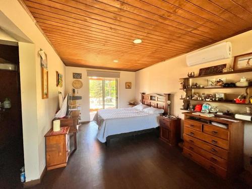 a bedroom with a bed and a wooden ceiling at Casa Campestre in Molina
