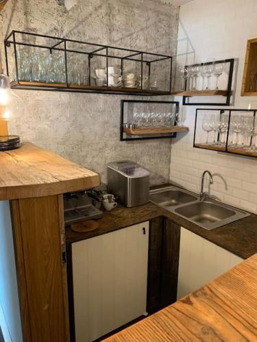 a kitchen with a sink and a counter top at Chalupa Adamův Dvůr in Zdíkov