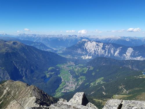 a view of a valley from the top of a mountain at Your BaseCamp! in Roppen