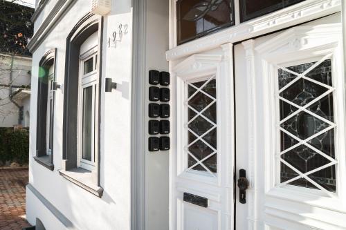 a front door of a house with french windows at Buer Appartment in Gelsenkirchen