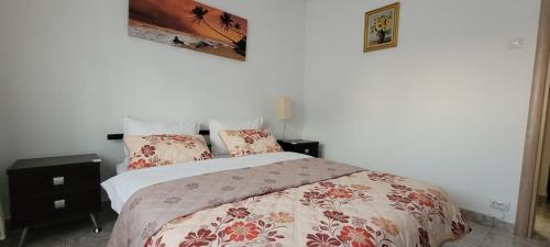 a bedroom with a bed and two pillows on it at Brancoveanu Apartament's in Bucharest