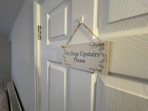 a no dogs upstairs please sign on a door at *Brecon Beacons,Log Burner, hot tub Dogs Welcome* in Crickhowell