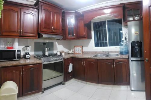 Kuchyň nebo kuchyňský kout v ubytování Apartamento en las americas