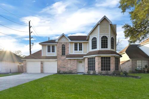a large house with at My Villa & Pool in Humble in Humble