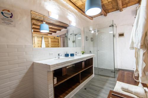 a bathroom with a sink and a shower at Topara Hotel Boutique in San Vicente de Cañete