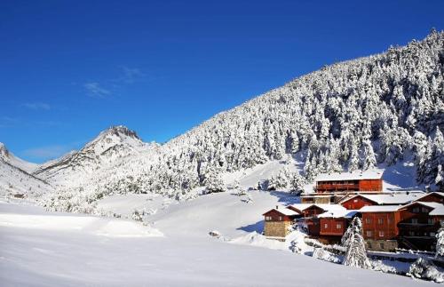 a ski lodge in the snow on a mountain at S Valle de incles- Grandvalira free parking in Canillo
