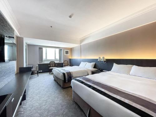 Postel nebo postele na pokoji v ubytování Guide Hotel Kaohsiung Liuhe