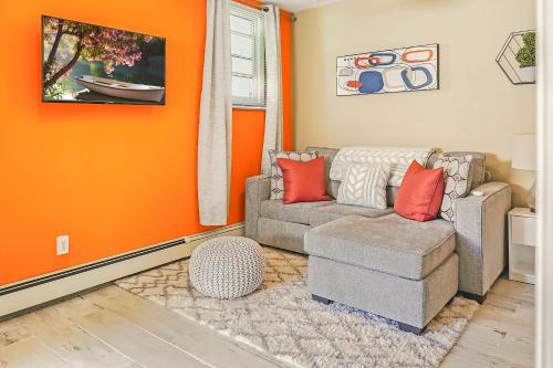 a living room with a couch and a chair at THE COZY CORNER SUITE* *FAST WIFI* *278 Mbps* *30 MIN TO NYC in Unionport